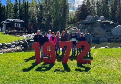 Class of 1972 reunion on the lawn behind red 1972 letters