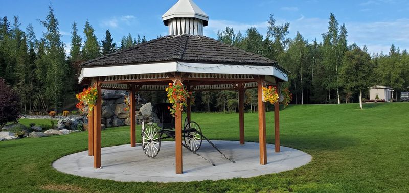 The white gazebo with its cupola on the lawn