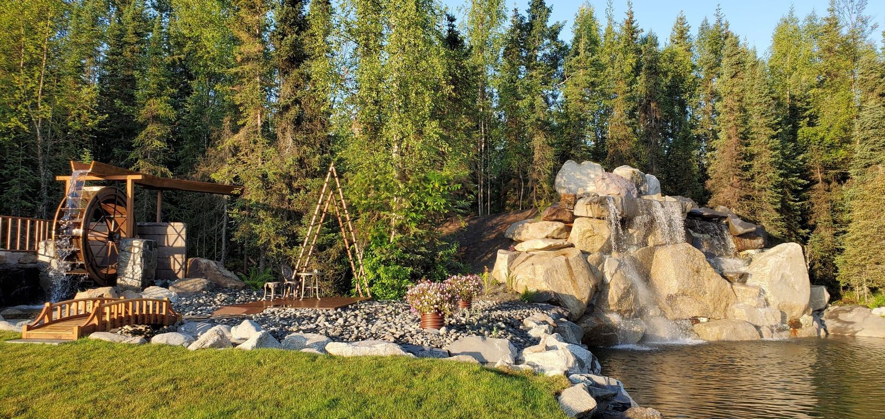 The waterfall, waterwheel and footbridge at Lakeside Falls